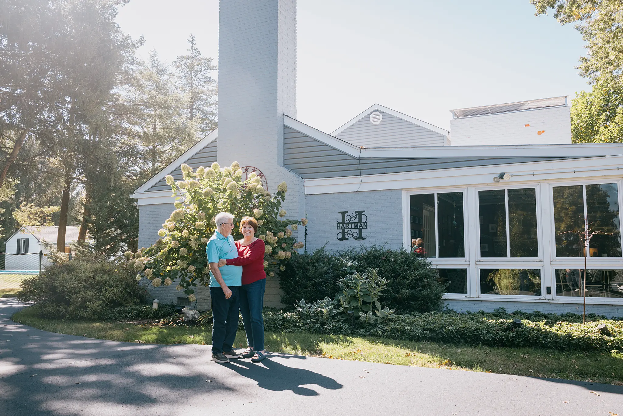 Ken and Dee Hartman outside of their home
